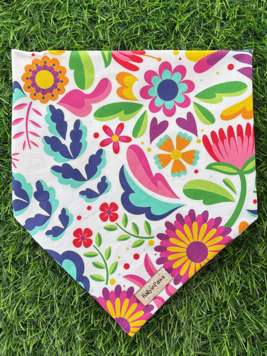 Colorful fiesta dog bandana on grass 